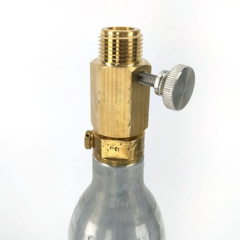 Brass valve attached to a metal bottle on a white background