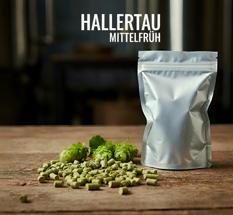 Silver package of Hallertau Mittelfruh hops on a wooden surface with hops spilling out.