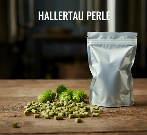 Silver packaging of Hallertau Perle hops on a wooden surface with hops scattered around.